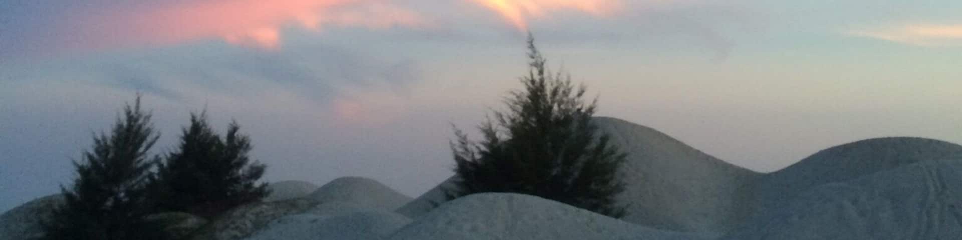 the sand dune from a far at dusk, we walked appx 3km to and fro the main road. The hike was a brief and easy not too winding or hilly, wearing a sneaker or flipper it's good enough. it's good to check the time of sun down as the way to the main road is dim.