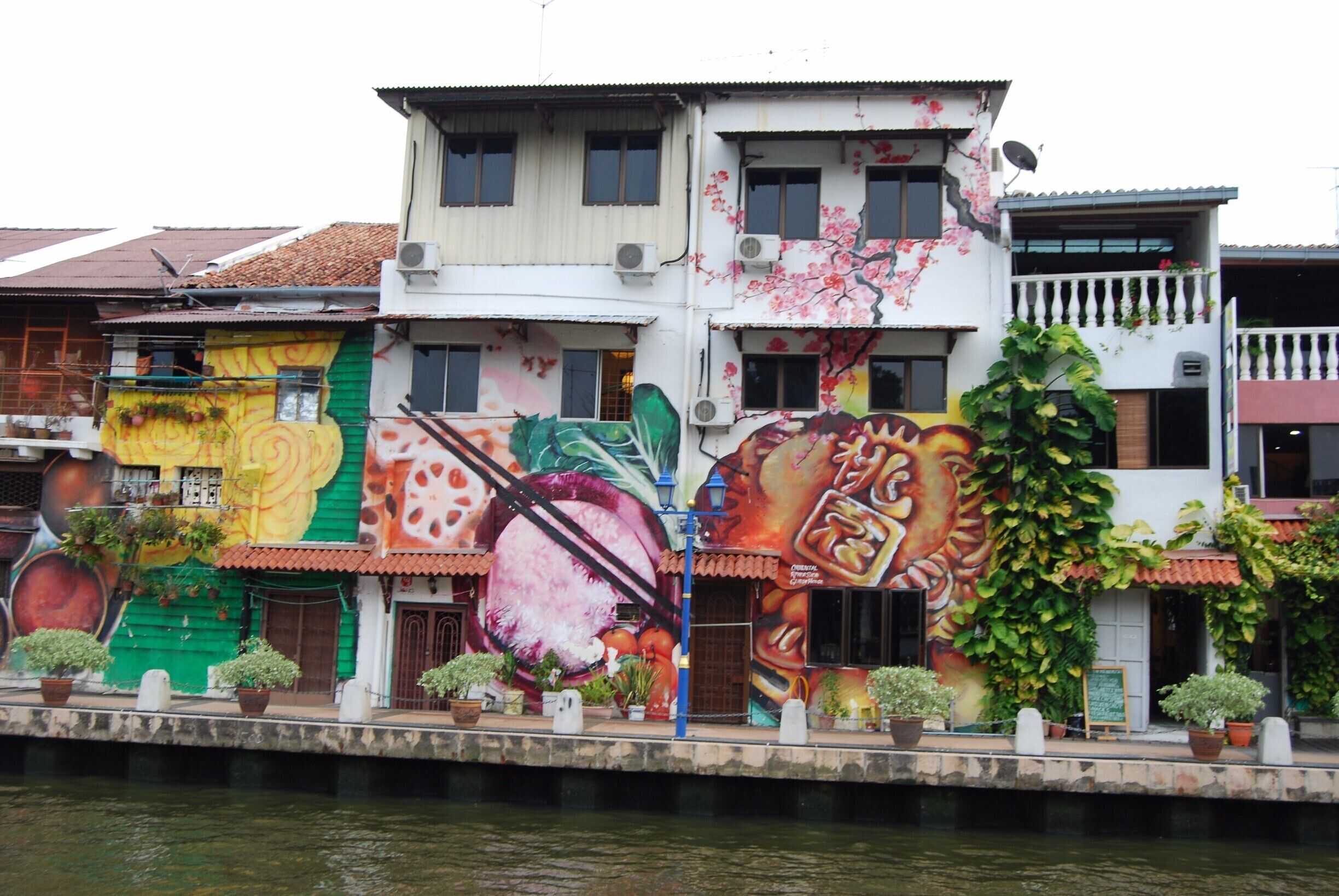 Local food is painted along this section of the riverwalk in Melaka, Malaysia. I love the bright colors and exaggerated sizes! 