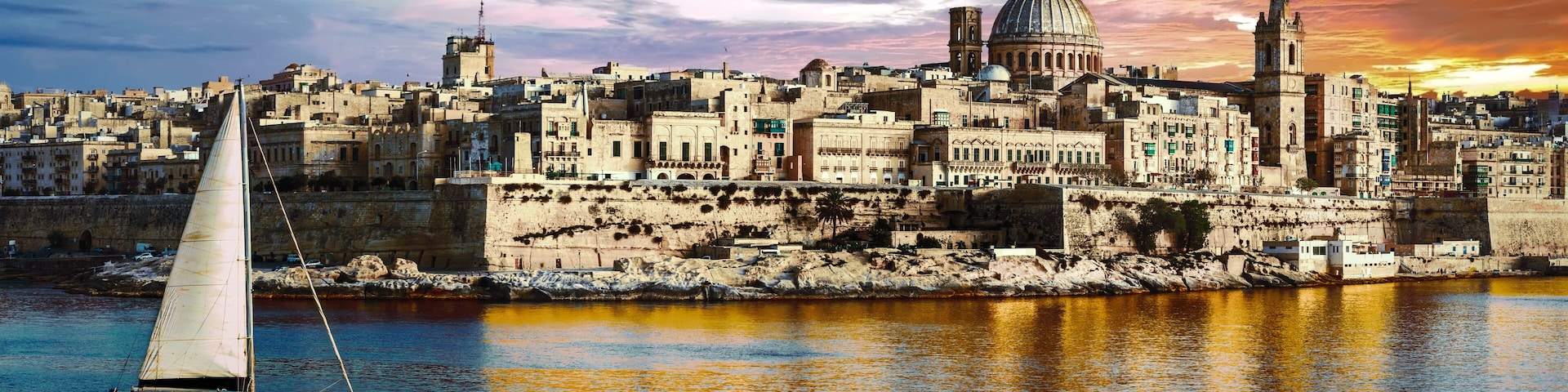panoramic view of Valetta over sunset and with a sail boat. Malta, Shutterstock ID 511520416, purchase_order: SP-1269 HA 2018 Batch 1, Order: , client: , other: