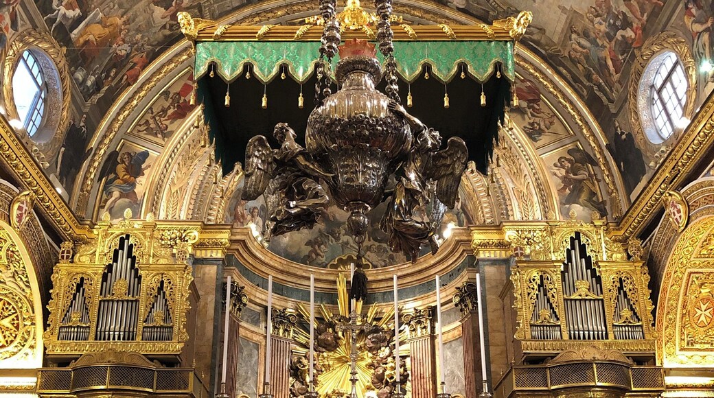 View from inside of a cathedral in Valletta, Malta. The St. John’s Co-Cathedral is a cathedral decorated in baroque style. This is a view of the altar.