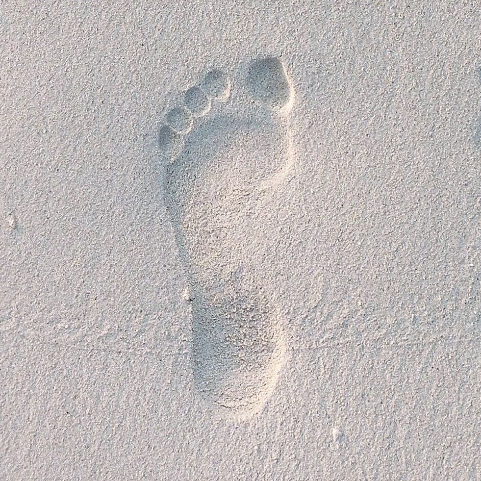 Imprint on the white sandy beaches of Maldives. 