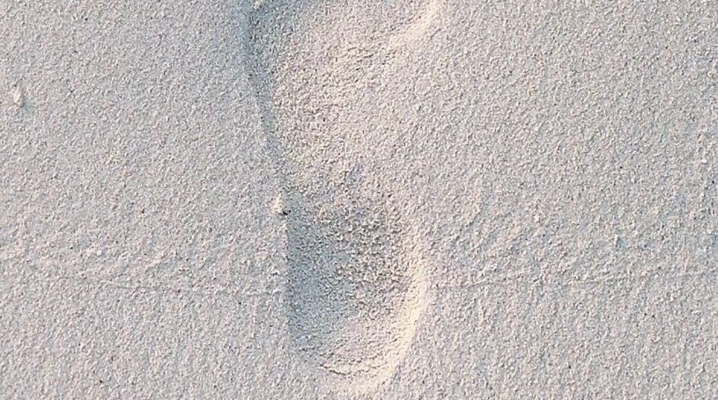 Imprint on the white sandy beaches of Maldives.