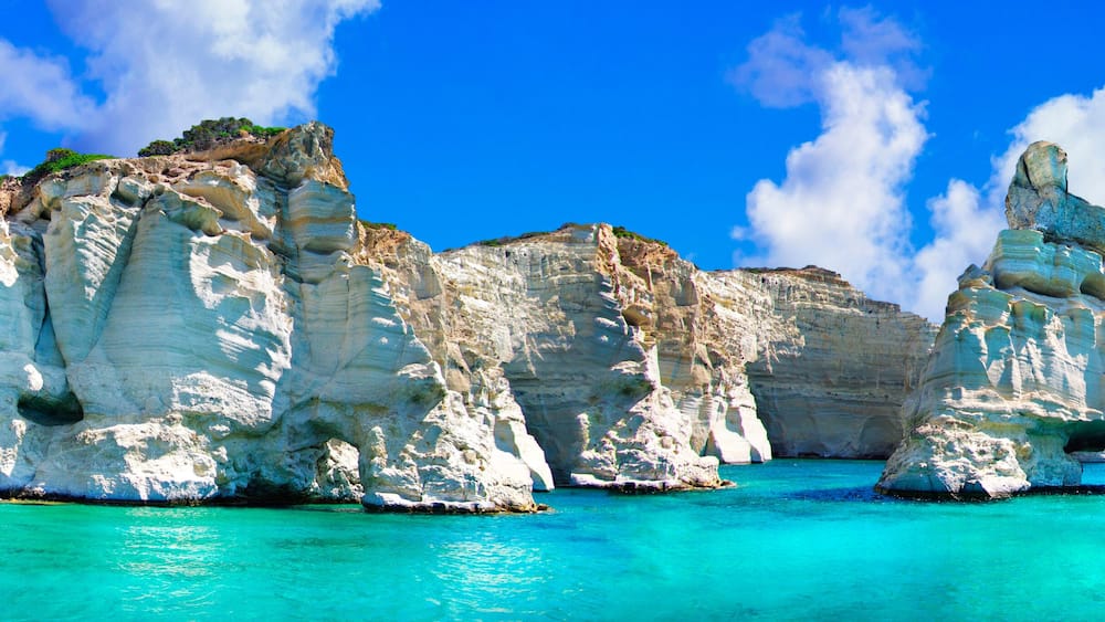 Crystal clear sea of Greek islands. Milos, boat trip in Kleftiko bay. Cyclades