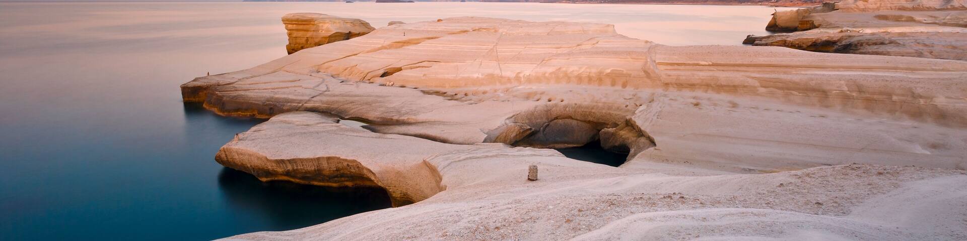Coastal scenery with pale volcanic rocks near Sarakiniko beach in Milos island, Greece.