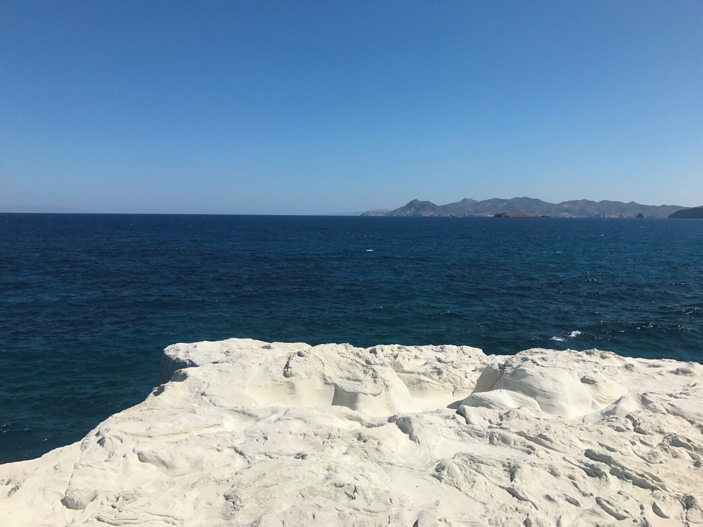Sarakiniko beach on Milos Island is made of volcanic rock shaped from the sea. The caves, shapes, and the inlet beach below make this a must see. 
Stop by Mandrakia the small fishing village down the road for some of the best, fresh seafood after you beach day. You won't regret it!
#lifeatexpedia