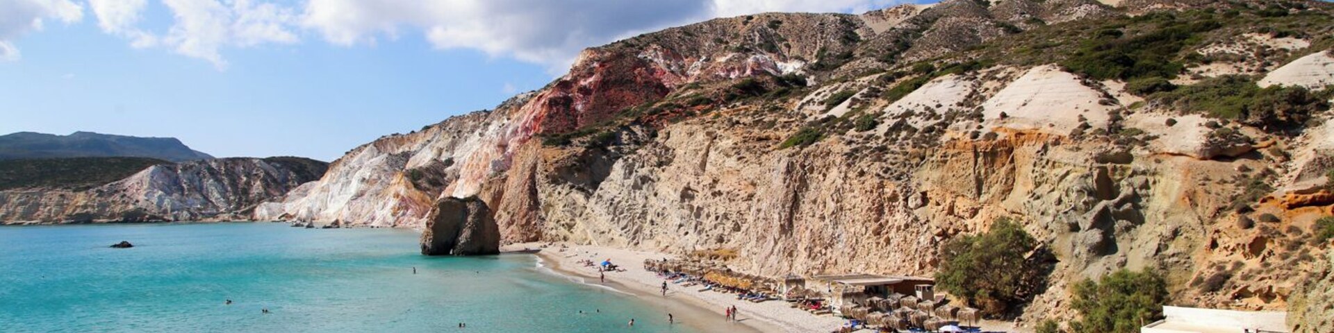 Firiplaka Beach was one of our favorites on the island of Milos. The imposing (and colorful!) volcanic rock blew us away. As much as I loved the views out over the water, I couldn't help but turn around to admire the beautiful red and white cliffs behind us. We only wished that we had discovered this beach earlier in our visit to Milos! #beach