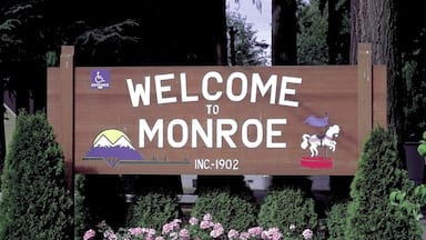 Monroe which includes flowers and signage