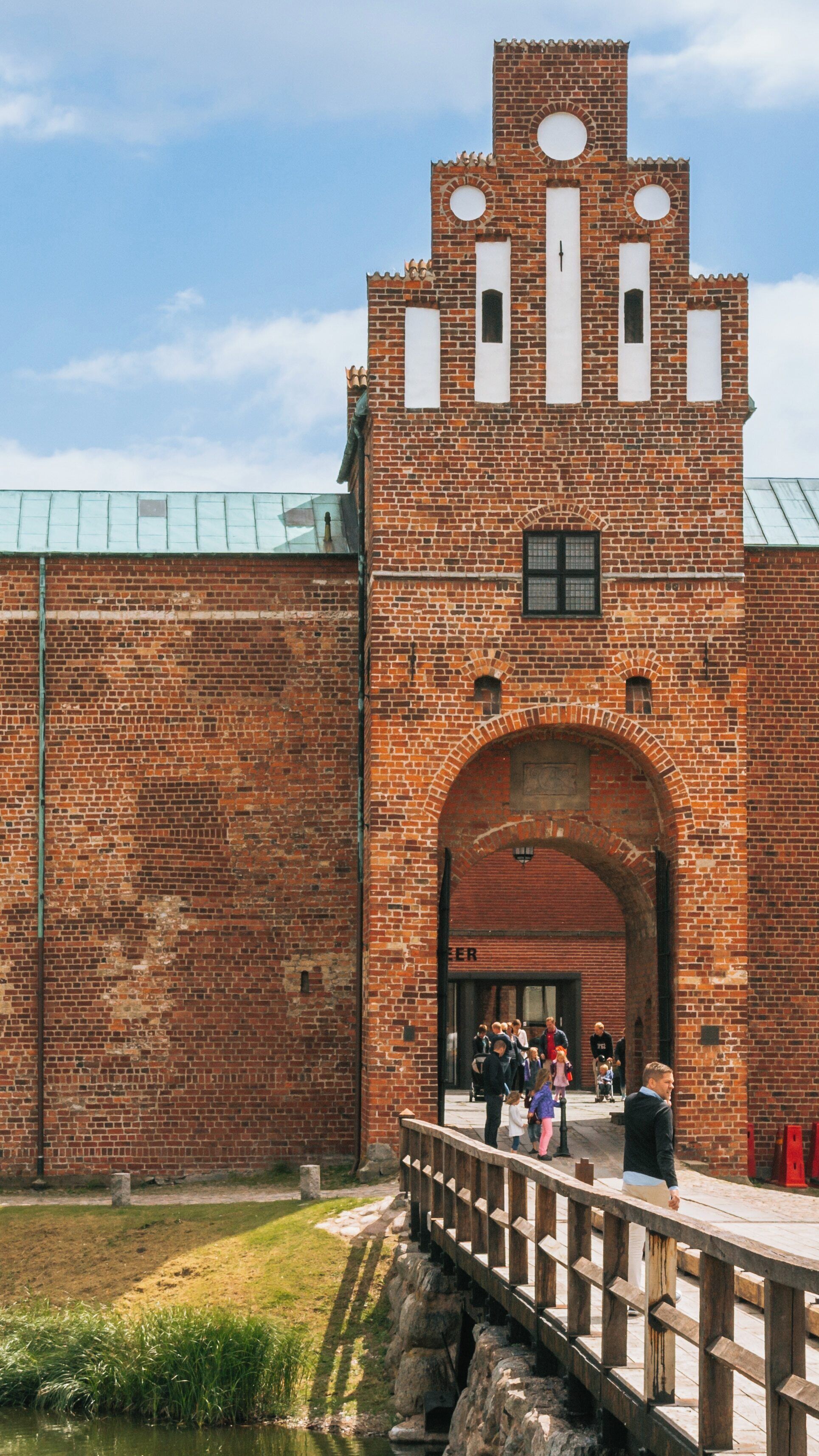 Malmo Castle entrance bustling with visitors in the heart of Centrum, Malmö, Skåne County, Sweden