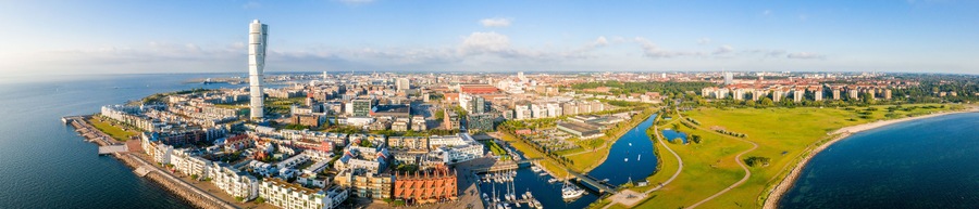 Beautiful aerial view of the Vastra Hamnen (The Western Harbour) district in Malmo, Sweden, during sunset. View from above.