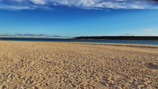 Kurima Island and Kurima Bridge seen on a beach in Miyako Island, Okinawa, Japan.