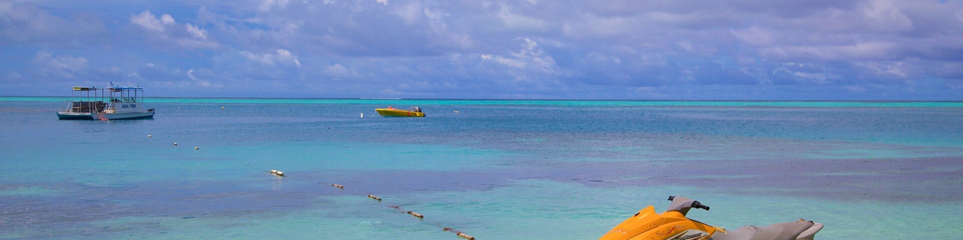 Mana Island showing general coastal views and jet skiing