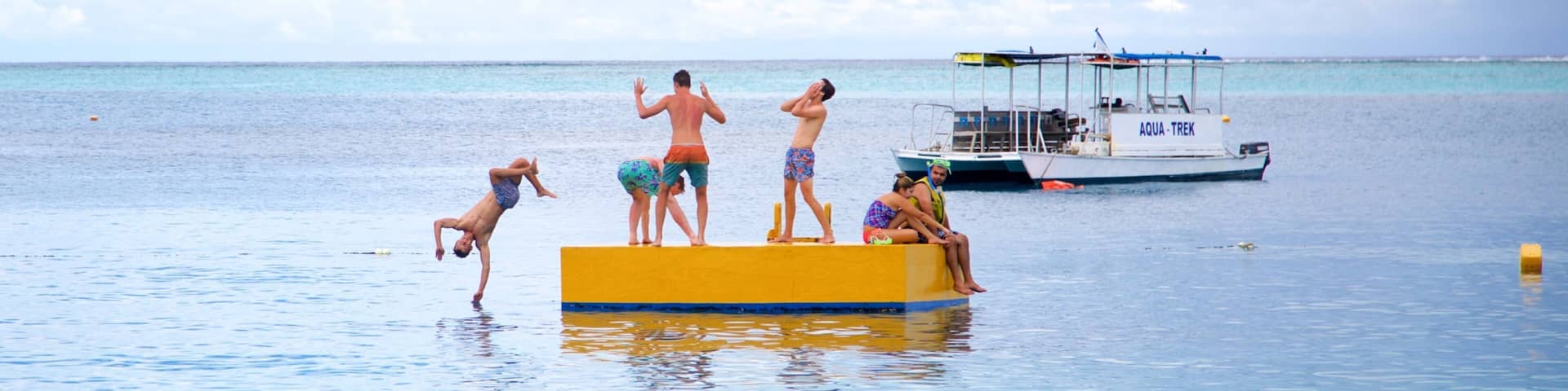 Mana Island showing swimming and general coastal views as well as a small group of people