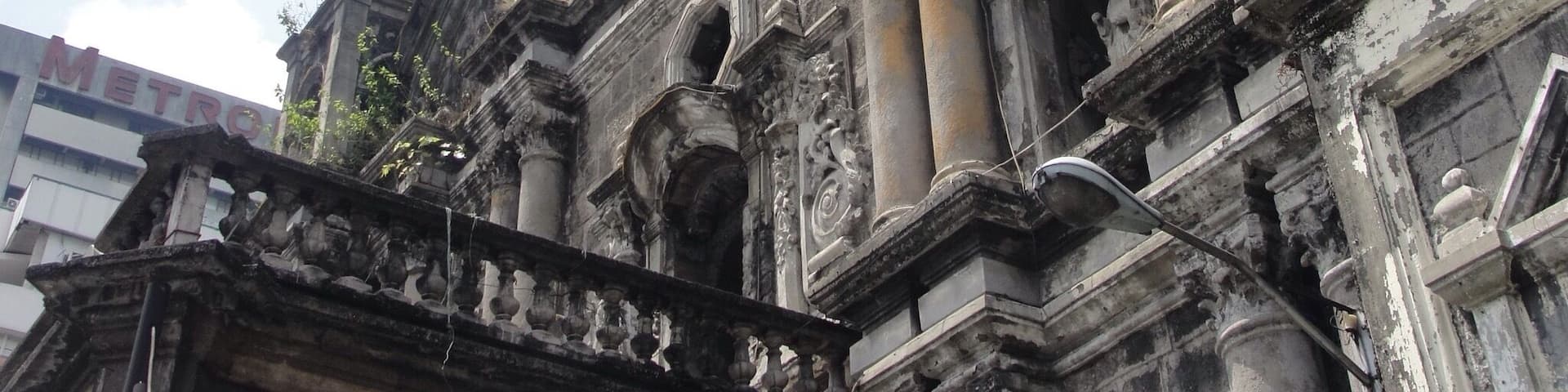 An ornate historical building with intricate carvings and columns.