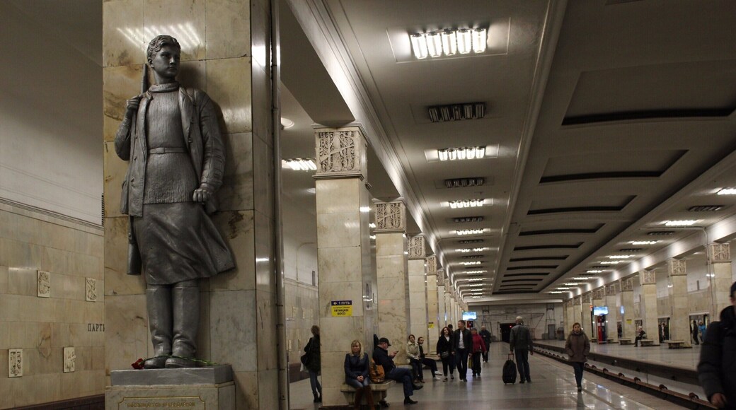 Bronzed statues of partisans carrying AK-47.