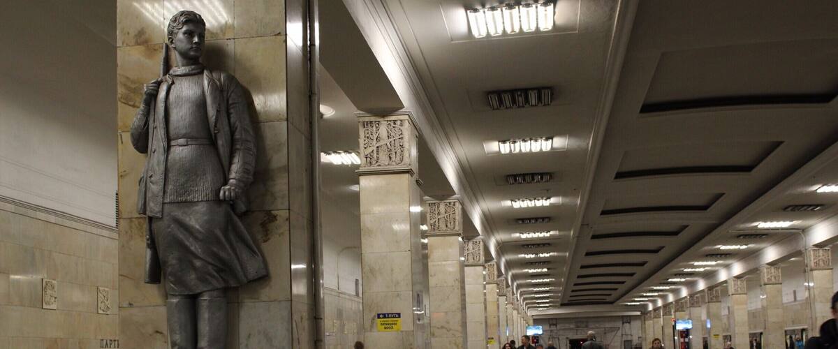 Bronzed statues of partisans carrying AK-47.