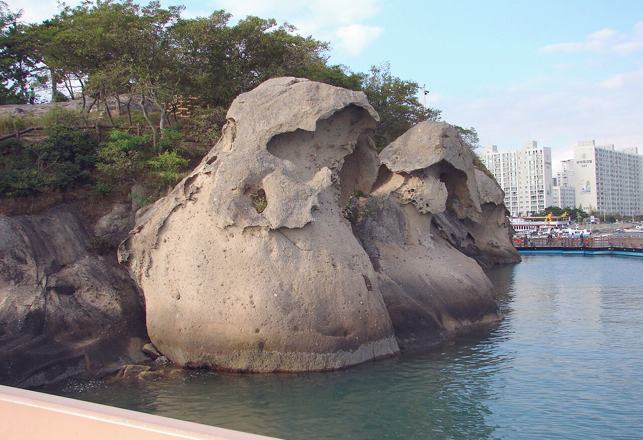 Sandstone and Tafoni formations found on the shore of Mokpo's east harbor, at the mouth of he Yeongsan River, South Jeolla Province, South Korea. The name of this formation at Mokpo is "Gatbawi", meaning a rock shaped like a Gat, a traditional Korean constume item worn like a hat.
