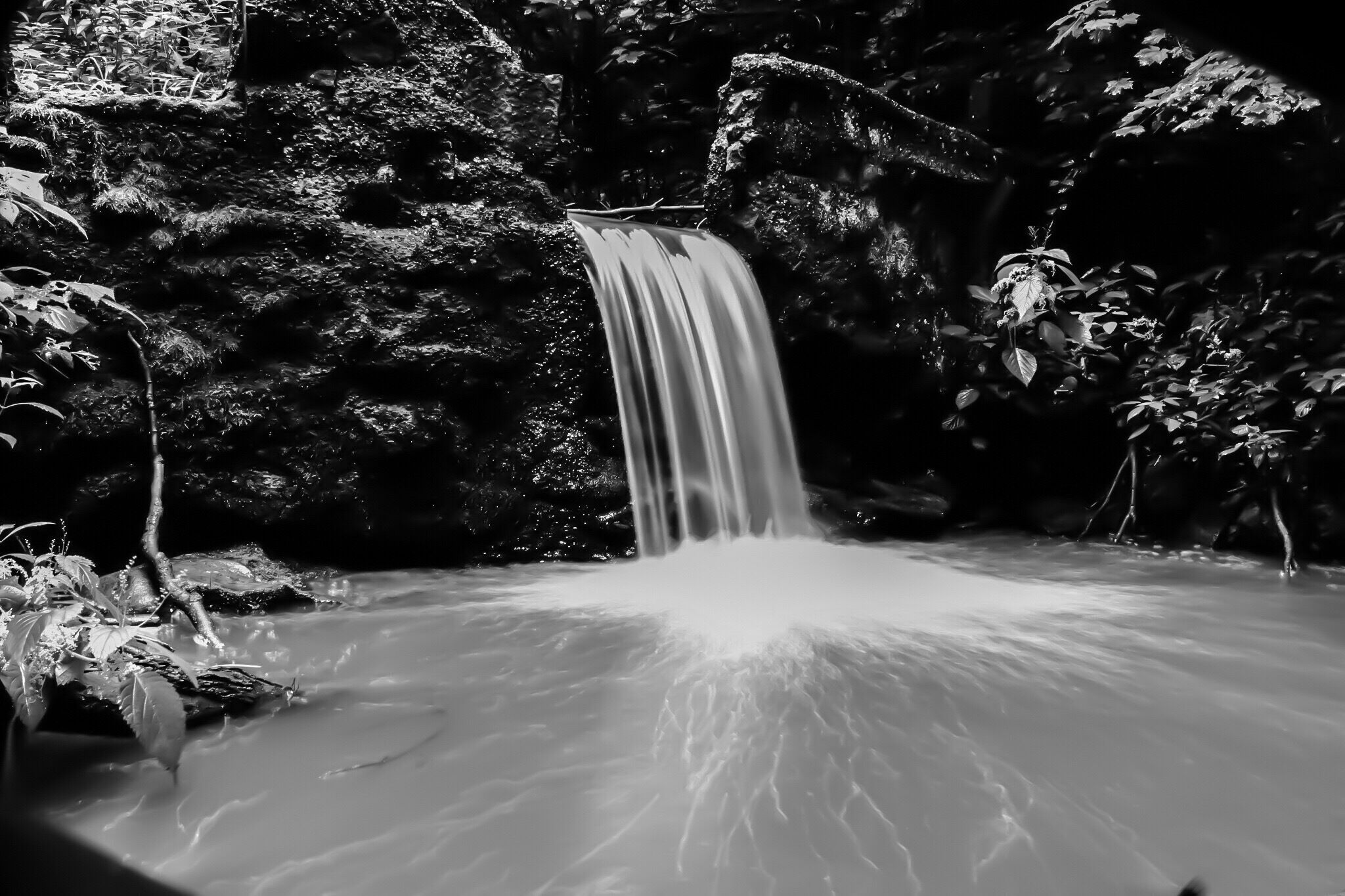 Hike above the main falls to find the old mill race