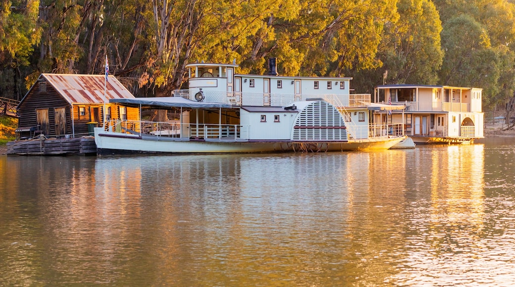 Golden sunset lighting and reflection on an historic paddle steamer