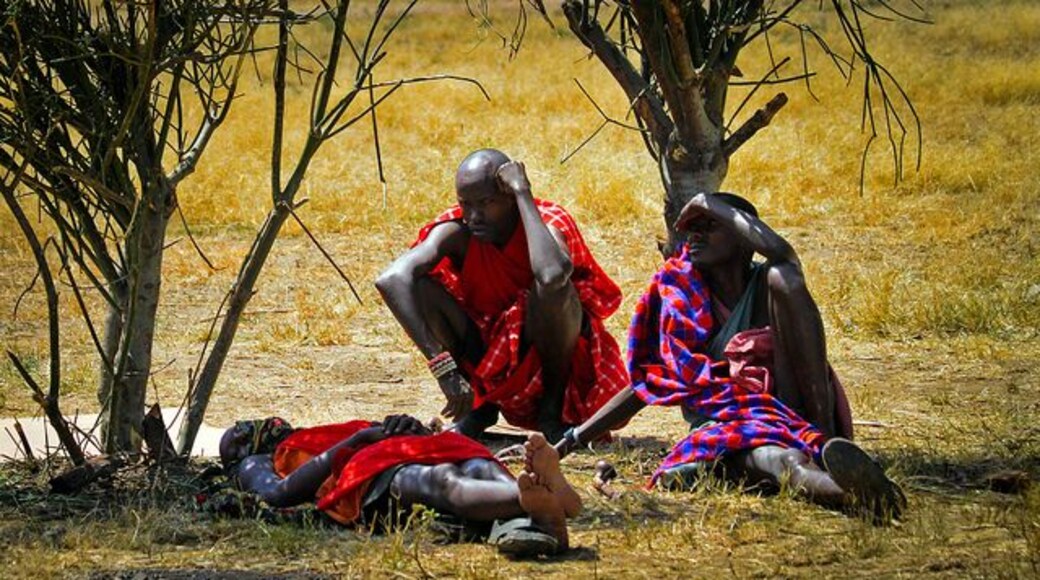 Some Maasai tribesmen relaxing and enjoying some shade during our visit to their village.