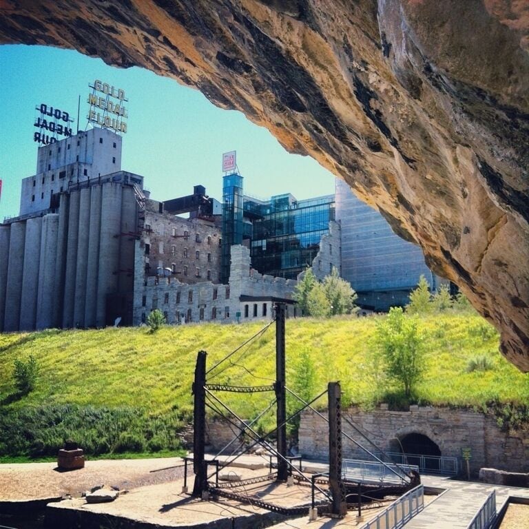 Mill City Museum and Gold Medal Flour from Mill Ruins Park under Stone Arch bridge on Mississippi River. August 5, 2012 www.bradleyhanson.com