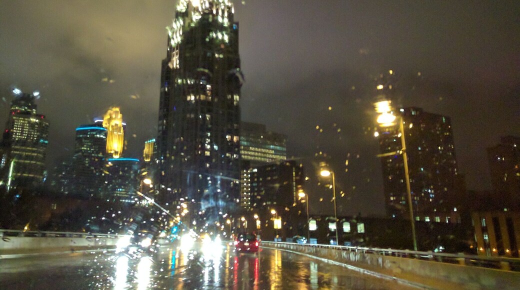 Yeah it's a total cliché but one I love. A surprisingly warm October night through a wet windshield. The hard part was missing the wipers