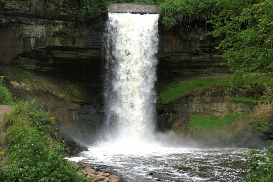 Beautiful waterfall in the city limits of Minneapolis. Continue down the trail to walk along the banks of the Mississippi River.