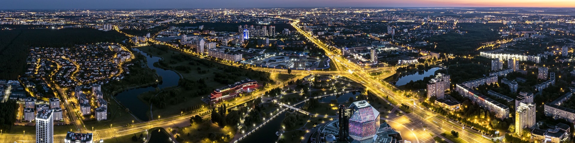 picturesque panoramic aerial view cityscape with bright street illumination. drone photo.