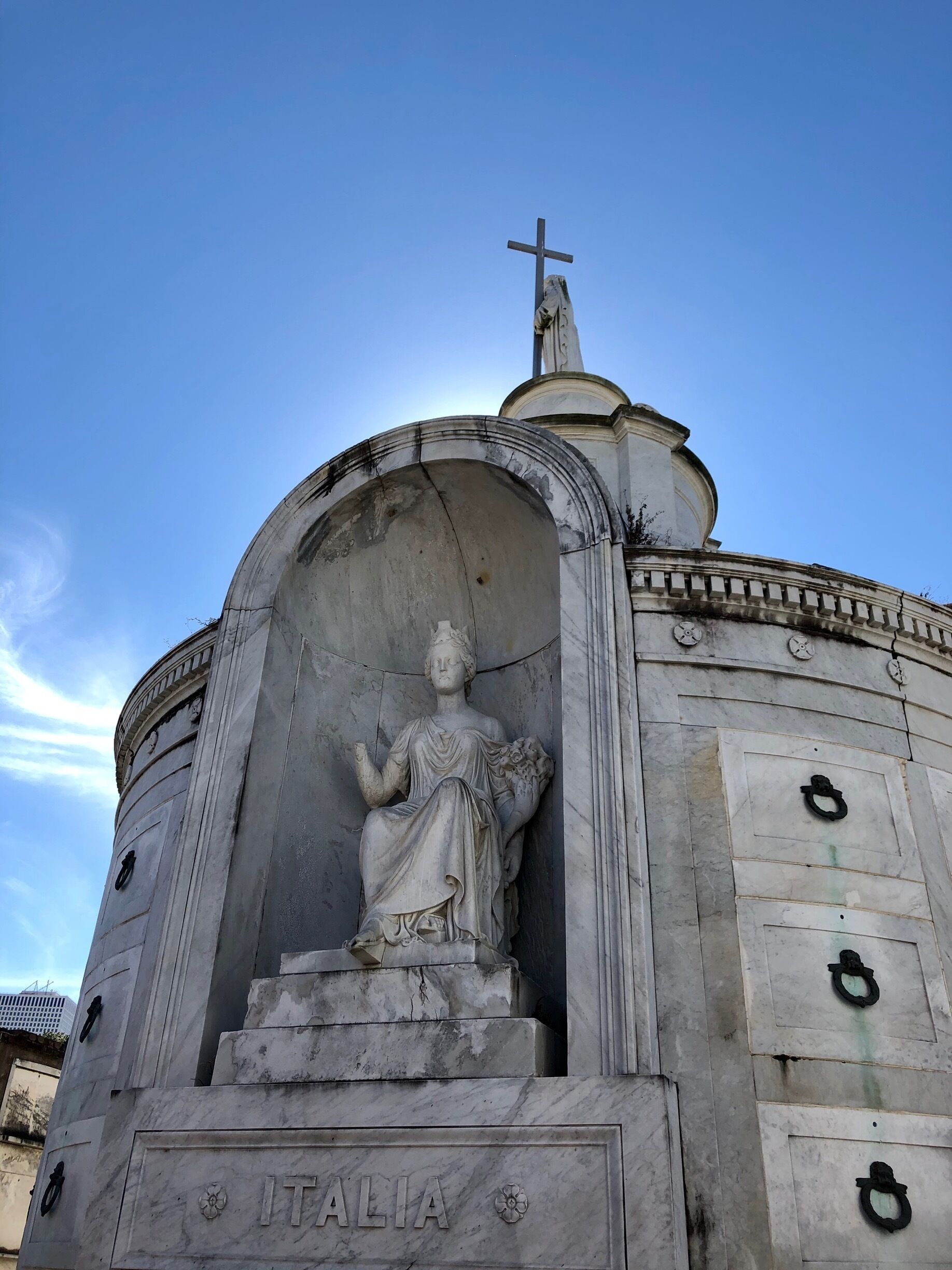 The Italian Benevolent Society Tomb towers above all others in New Orleans’s oldest cemetery. 