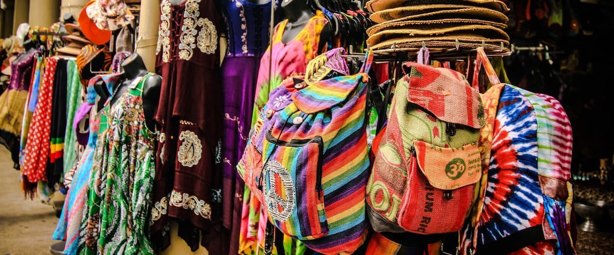 New Orleans French Market area Decatur Street . Open shopping and color color color!!! The music in the air....smells of fresh beignets cooking up 24/7.