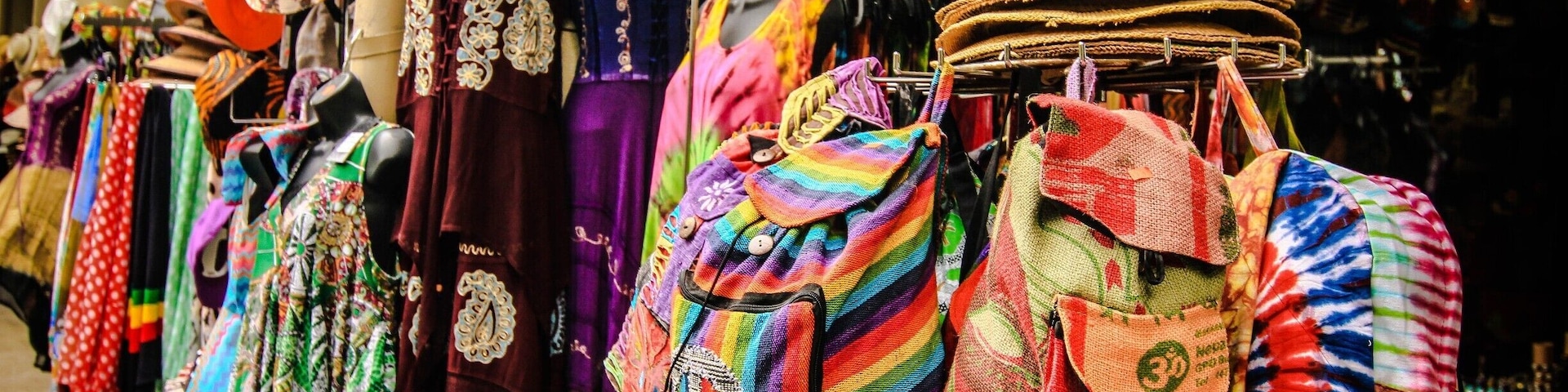 New Orleans French Market area Decatur Street . Open shopping and color color color!!! The music in the air....smells of fresh beignets cooking up 24/7.