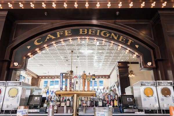 The signature lighted arch of Cafe Beignet in the bar area at their Decatur St. location in New Orleans, Louisiana.