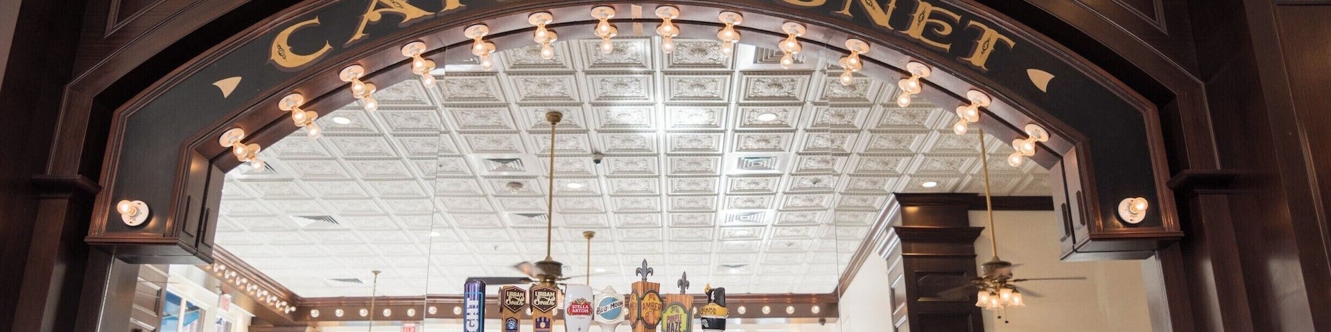 The signature lighted arch of Cafe Beignet in the bar area at their Decatur St. location in New Orleans, Louisiana.