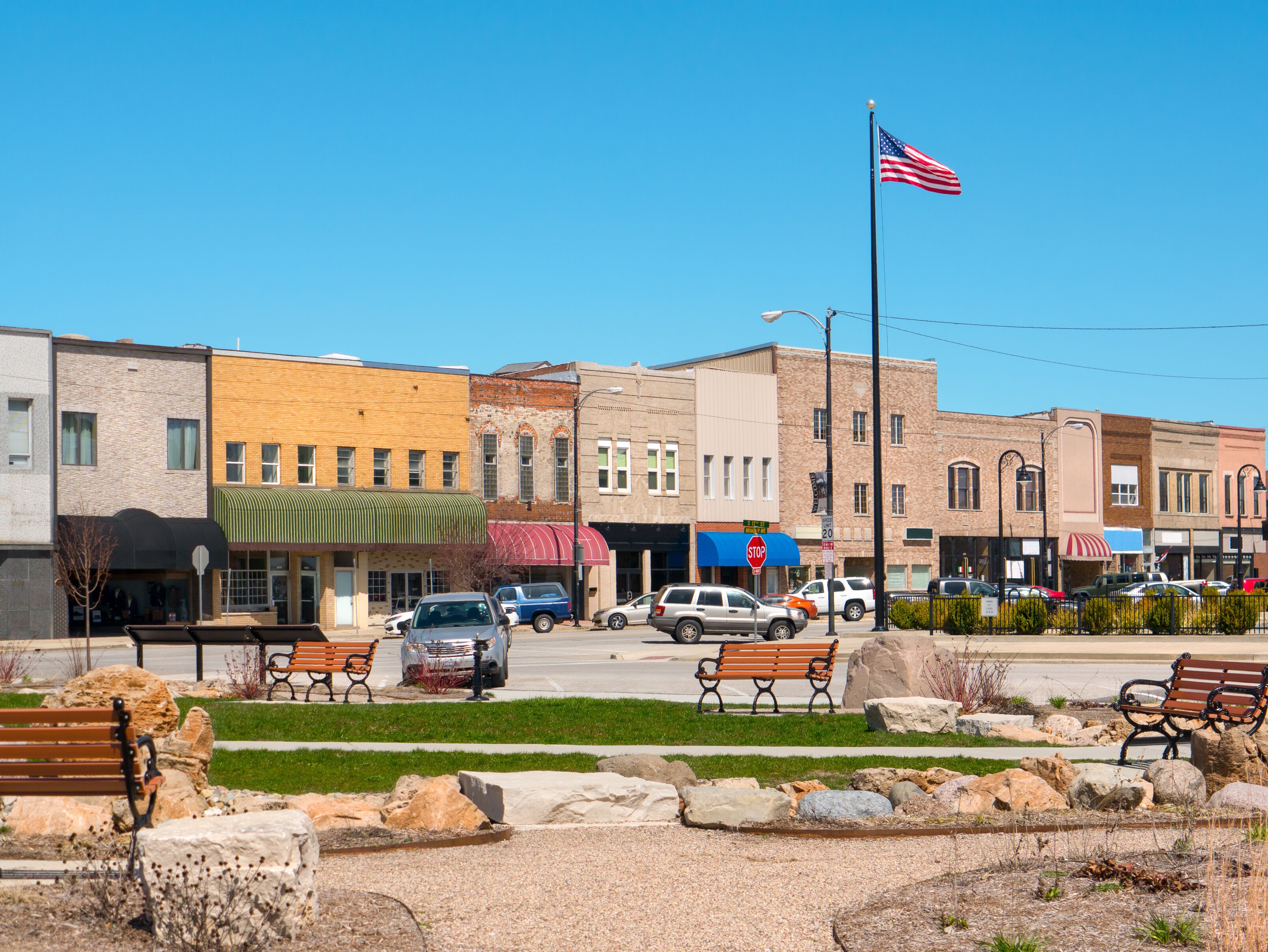 Small town main street USA with business storefronts and park Mattoon Illinois