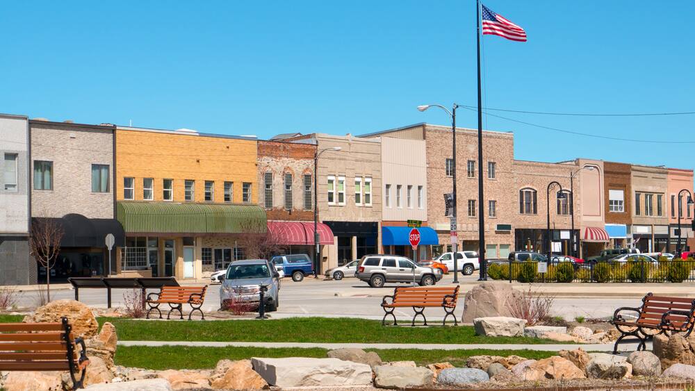 Small town main street USA with business storefronts and park Mattoon Illinois