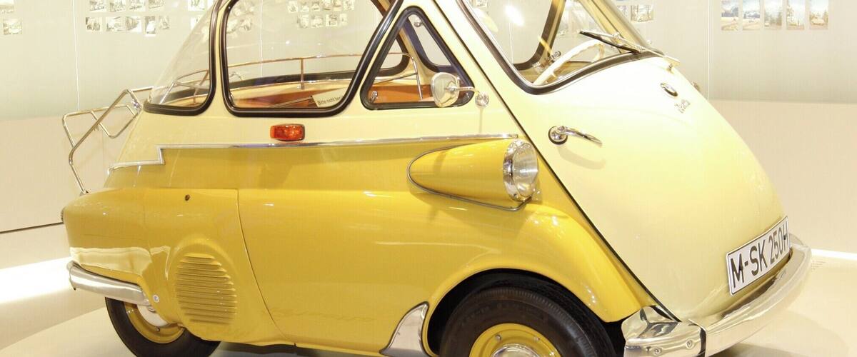I'm not a "Gear-Head" by any means but... I do love German engineering and am specially fond of BMW, who now owns MINI Cooper.
This is the 1955 BMW Isetta (1955–62), also known as the "Bubble-Car". 161,728 units were made.
Although Italian designed it was licensed for manufacture in several different countries. If your looking to get a decent Isetta today expect to pay a bit north of $40,000.
I like it... It's just silly enough for me and I need to know how many clowns we can fit into one.
As far as the museum goes... a MUST do when visiting Munich, even if your not a gear-head.