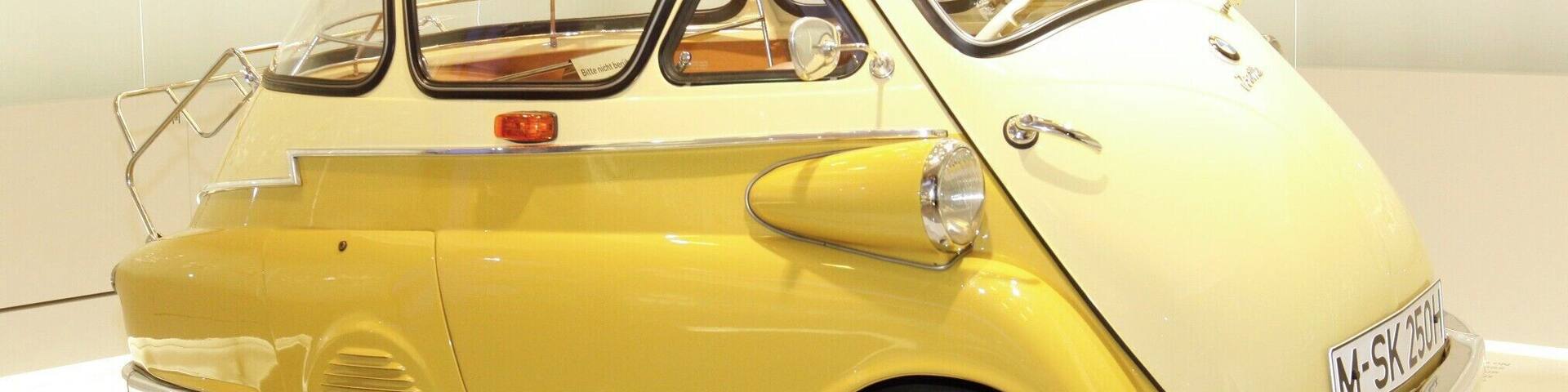 I'm not a "Gear-Head" by any means but... I do love German engineering and am specially fond of BMW, who now owns MINI Cooper.
This is the 1955 BMW Isetta (1955–62), also known as the "Bubble-Car". 161,728 units were made.
Although Italian designed it was licensed for manufacture in several different countries. If your looking to get a decent Isetta today expect to pay a bit north of $40,000.
I like it... It's just silly enough for me and I need to know how many clowns we can fit into one.
As far as the museum goes... a MUST do when visiting Munich, even if your not a gear-head.