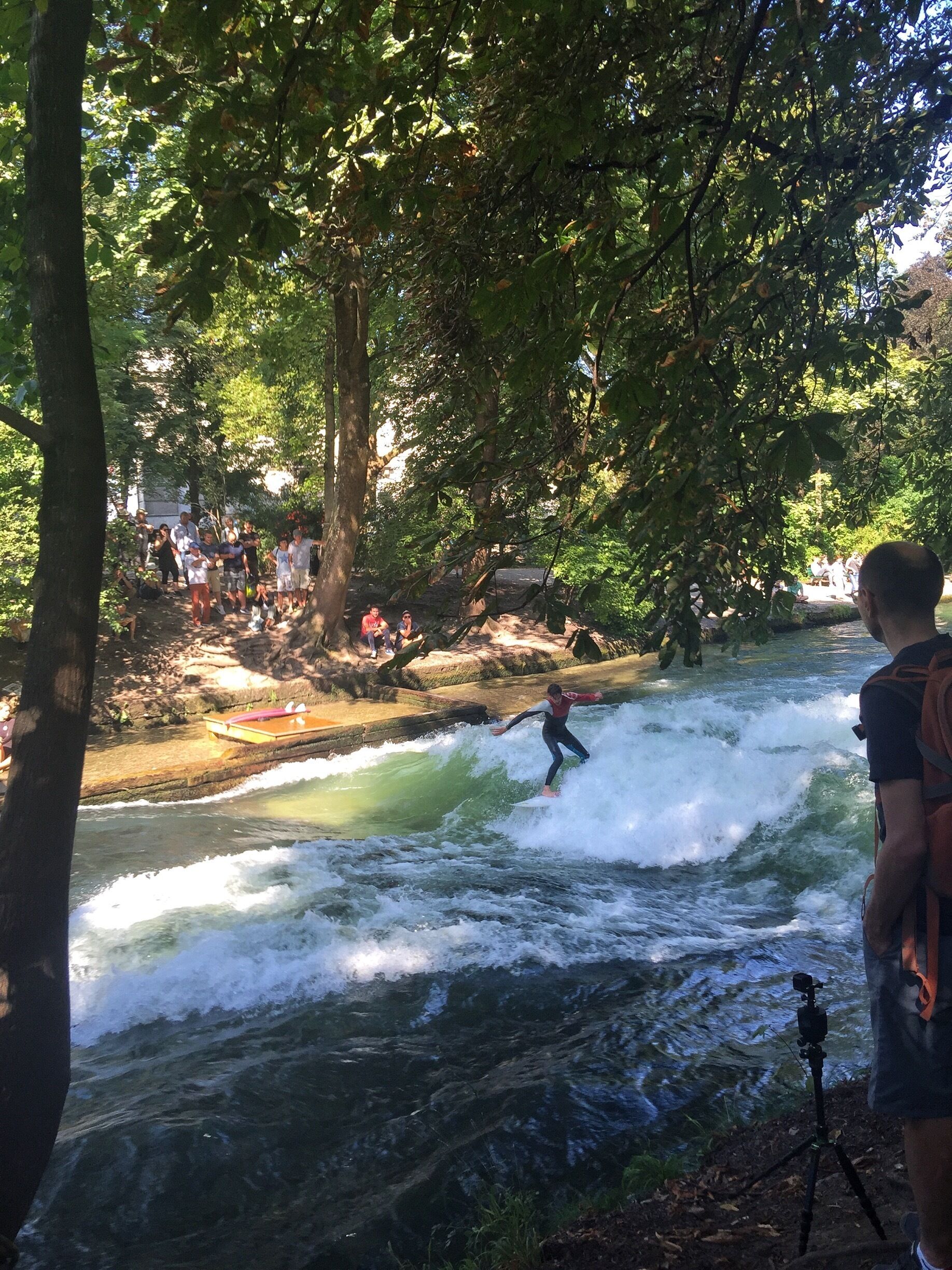 Watching the surfers on the canal in the English Garden in Munich is surprisingly mesmerizing. It's a standing wave created by a shelf on the bottom of the canal, though the surfers tweak the wave with boards on ropes they throw into the water. 