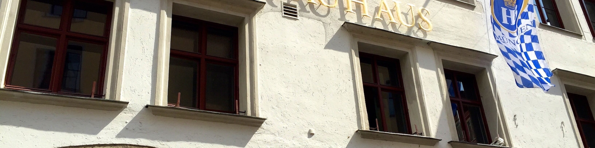 Welcome to the world`s most famous tavern! The Munich Hofbräuhaus is open 365 days à year. The Hofbräuhaus has been situated at the heart of Munich for ages.
The Hofbräuhaus am Platzl is a beer hall in Munich, Germany, originally built in 1589 by Bavarian Duke Maximilian I as an extension of the Staatliches Hofbräuhaus in München brewery. The general public was admitted in 1828 by Ludwig I. The building was completely remodeled in 1897 by Max Littmann when the brewery moved to the suburbs. All of the rooms except the historic beer hall ("Schwemme") were destroyed in the World War II bombings. The reopening of the Festival Hall in 1958 marked the end of the post-war restoration work.