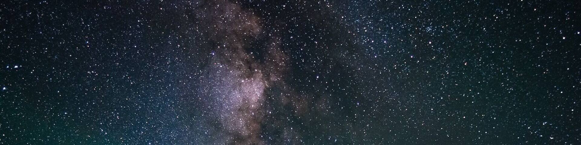 A night sky with stars and the Milky Way at Cedar Breaks National Monument.