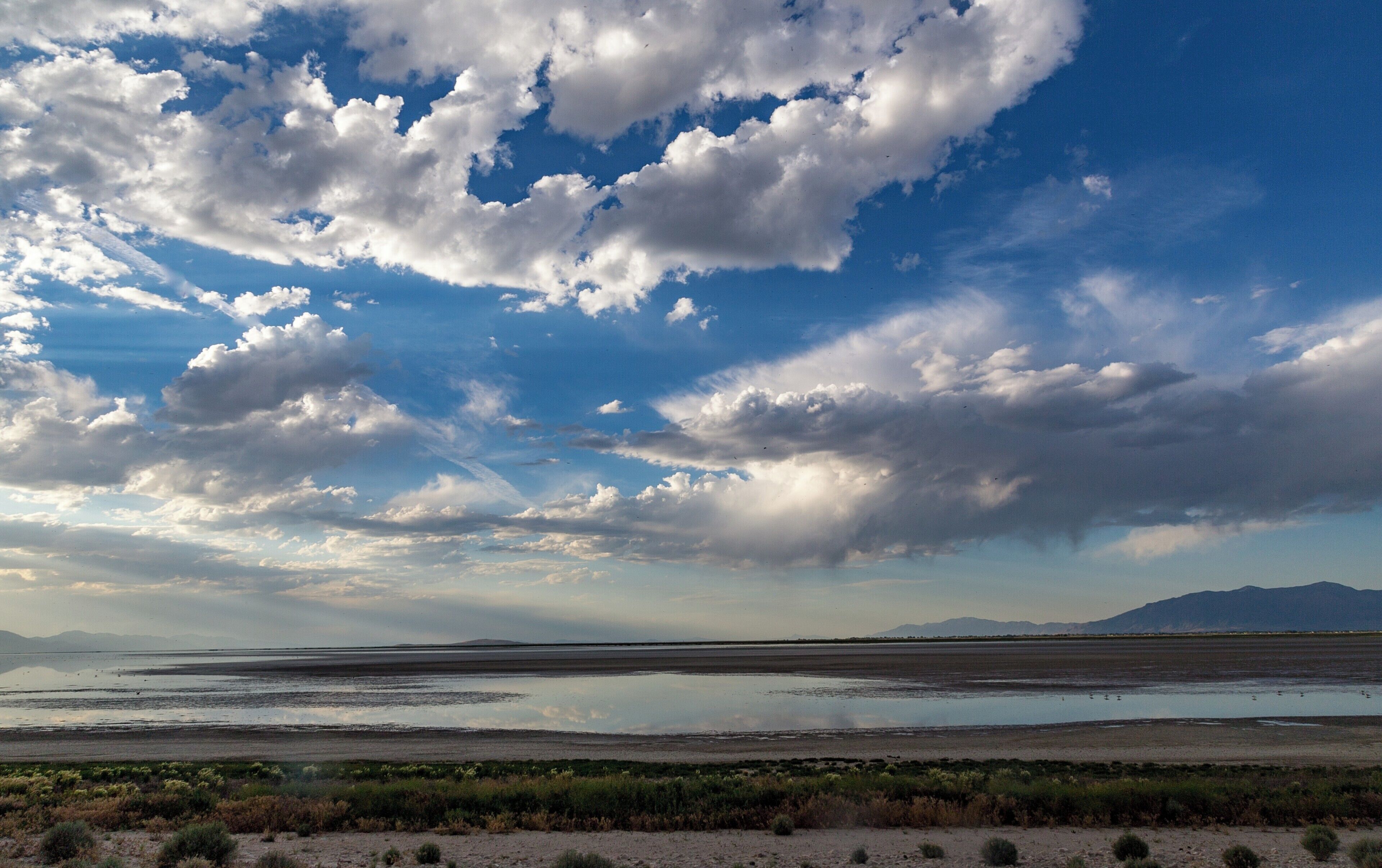 Antelope Island is beautiful state park just north of Salt Lake City on the Great Salt Lake. It is a nature reserve with bison, antelope (duh!) and some sweet Burrowing owls. This cloudscape is facing north over the small beach on the north side of the Island.

#LifeAtExpedia
#Beaches
