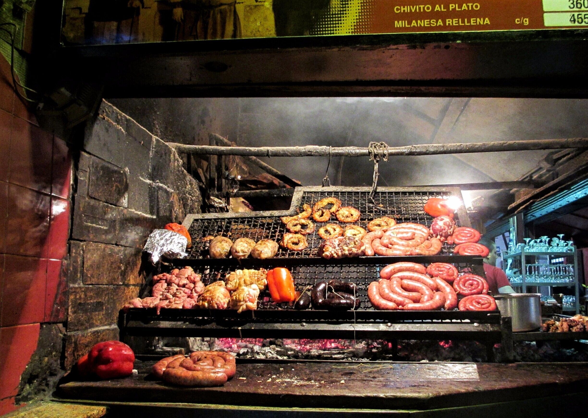 Absolutely loved Montevideo! Our great hotel was a little bit from the city center and the Old Town but was right on the Rambla which is the waterfront beach and walkway.

When in the Ciudad Vieja, the Old Town area of Montevideo, you can't help but smell all of the meat being cooked in a massive warehouse looking building.  This is Mercado del Puerto so grab a seat for massive amounts of meat and order the Medio y Medio, a mix of white and sparkling wine made there. 