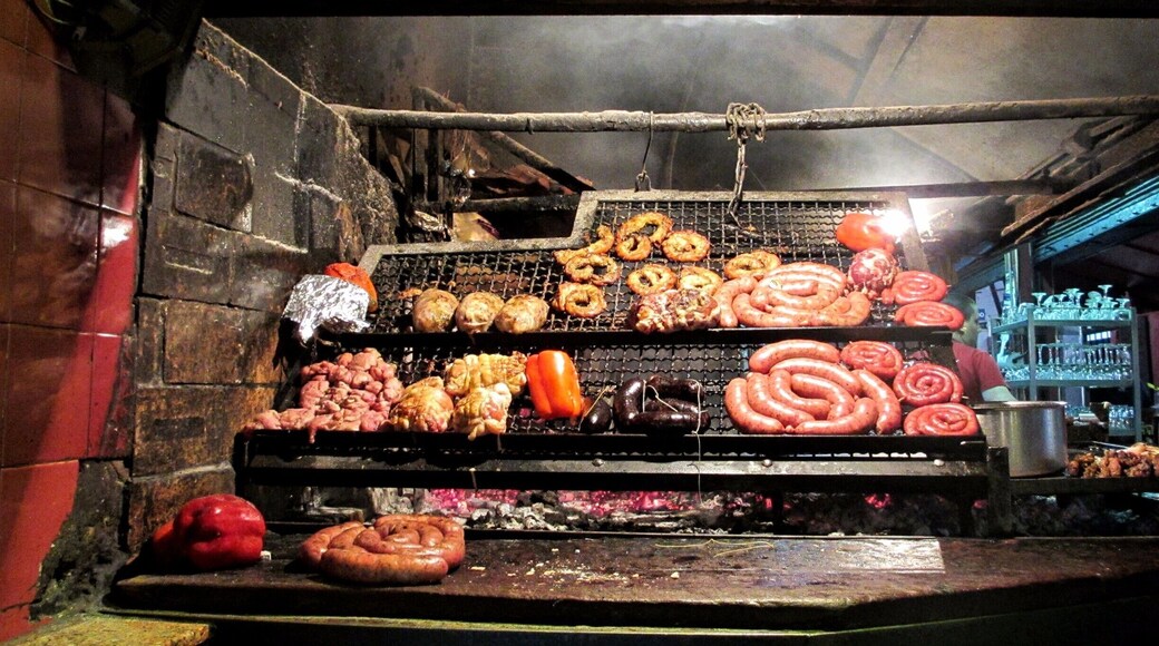 Absolutely loved Montevideo! Our great hotel was a little bit from the city center and the Old Town but was right on the Rambla which is the waterfront beach and walkway.
When in the Ciudad Vieja, the Old Town area of Montevideo, you can't help but smell all of the meat being cooked in a massive warehouse looking building. This is Mercado del Puerto so grab a seat for massive amounts of meat and order the Medio y Medio, a mix of white and sparkling wine made there.