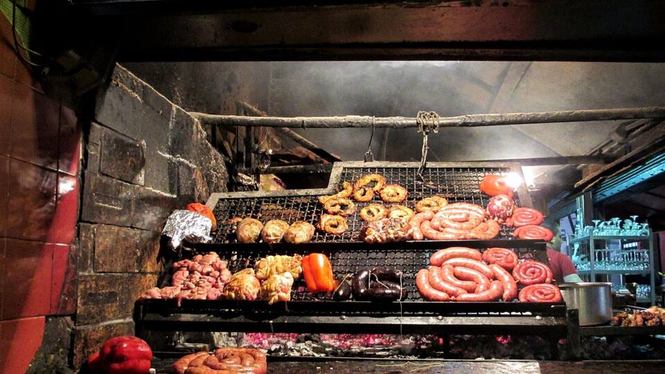 Absolutely loved Montevideo! Our great hotel was a little bit from the city center and the Old Town but was right on the Rambla which is the waterfront beach and walkway.
When in the Ciudad Vieja, the Old Town area of Montevideo, you can't help but smell all of the meat being cooked in a massive warehouse looking building. This is Mercado del Puerto so grab a seat for massive amounts of meat and order the Medio y Medio, a mix of white and sparkling wine made there.