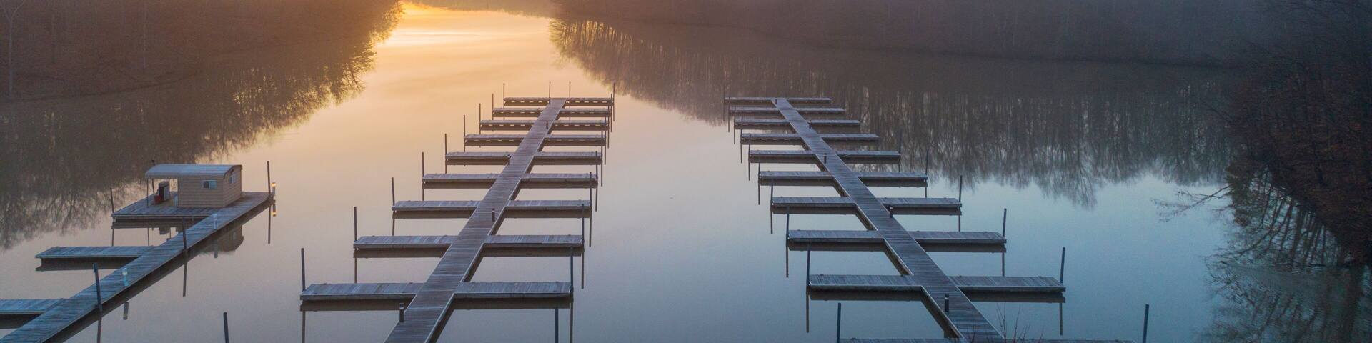 Boat docks at sunrise in fog, Stephen A. Forbes State Park, Marion County, Illinois.