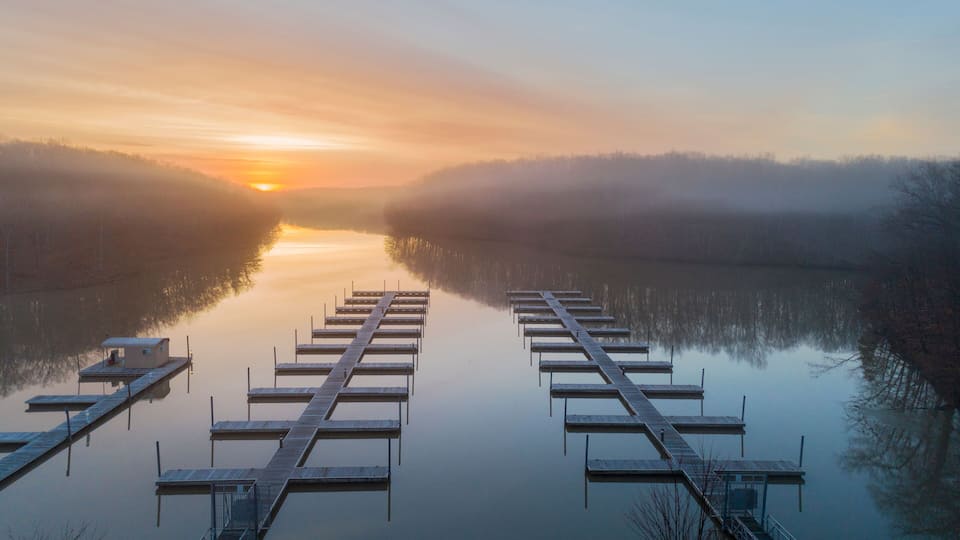 Boat docks at sunrise in fog, Stephen A. Forbes State Park, Marion County, Illinois.