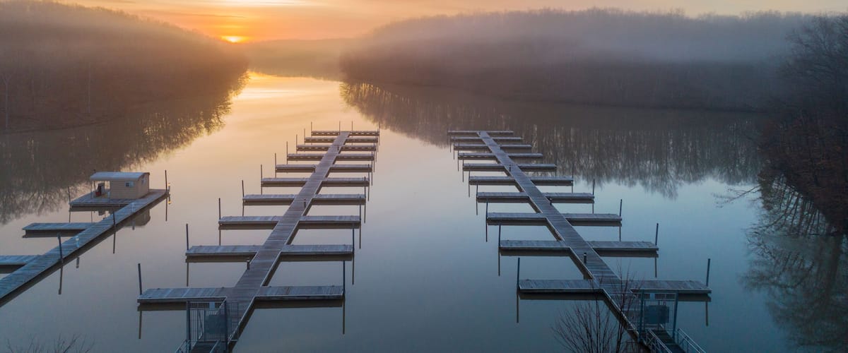 Boat docks at sunrise in fog, Stephen A. Forbes State Park, Marion County, Illinois.