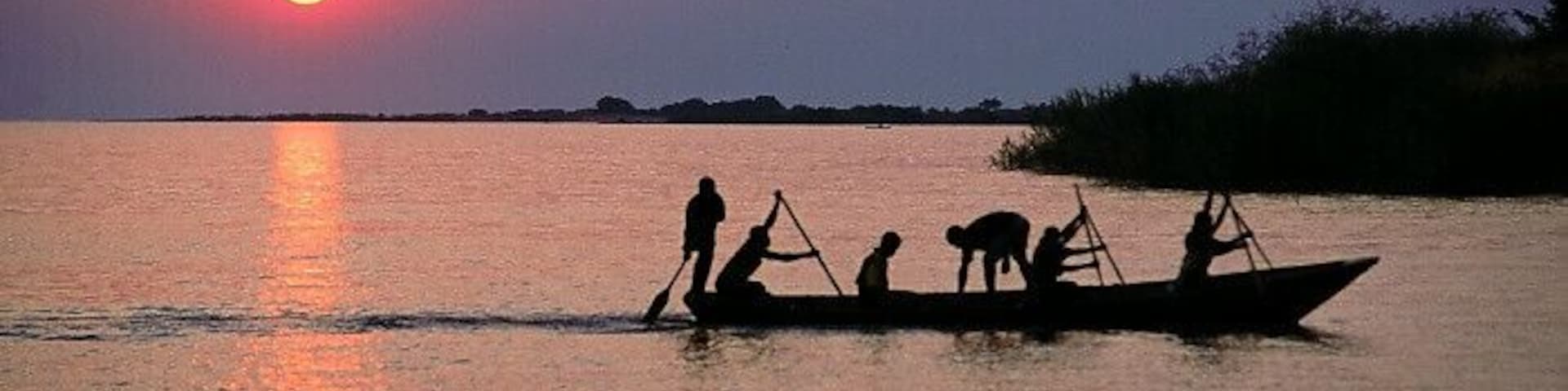 Local fishermen canoeing at Lake Victoria Mwanza Tanzania.