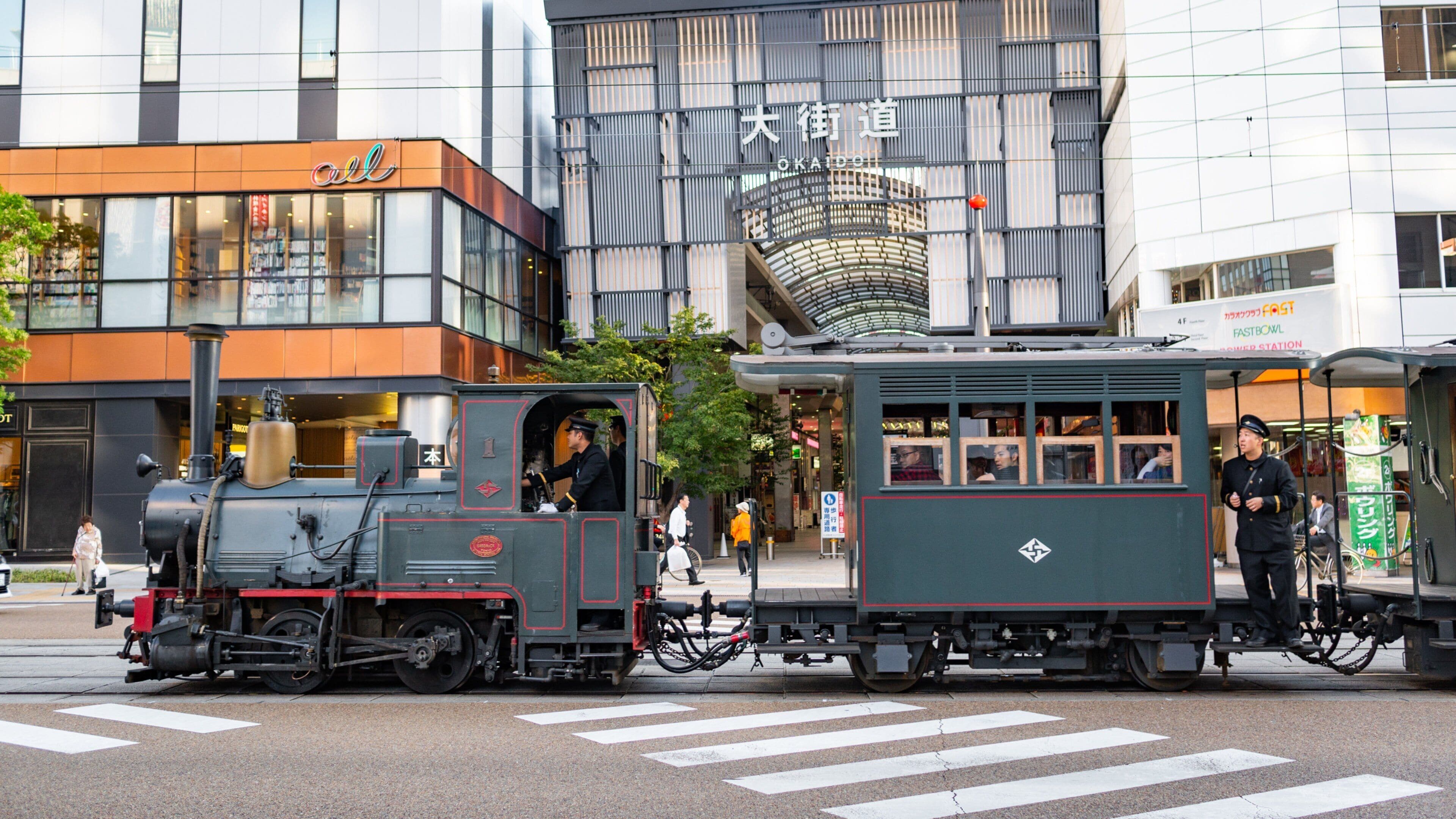 Matsuyama featuring street scenes, heritage elements and railway items