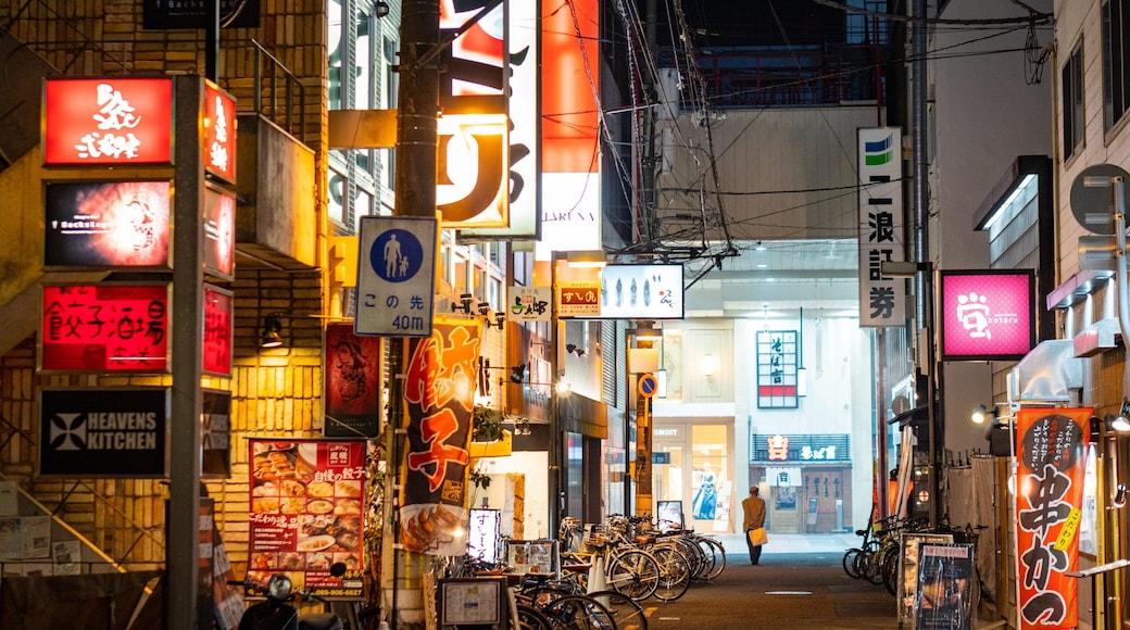 Matsuyama which includes night scenes, street scenes and signage