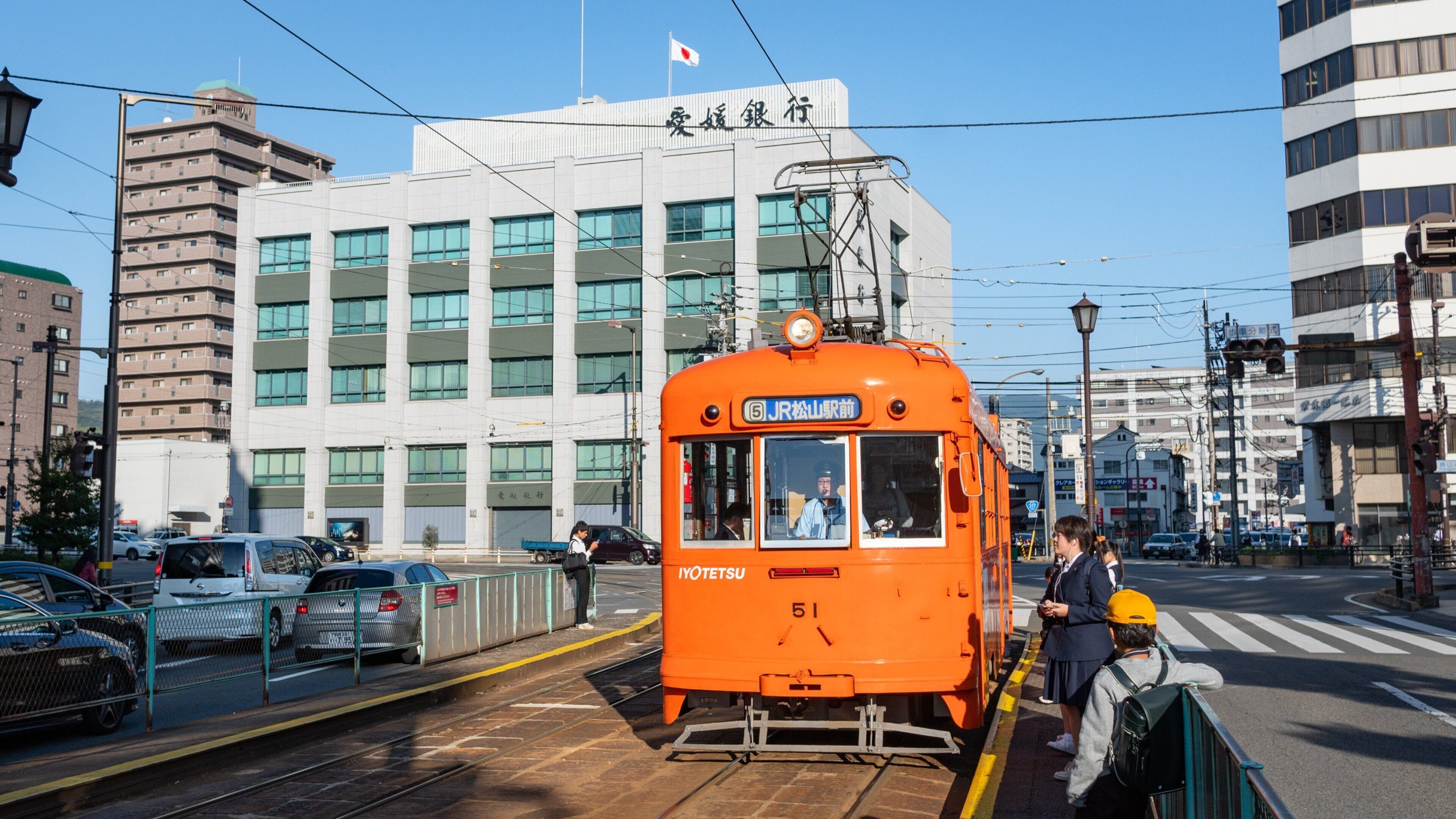 Matsuyama which includes railway items and street scenes